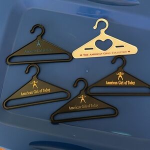 Five classic American Girl doll clothes hangers. EUC.